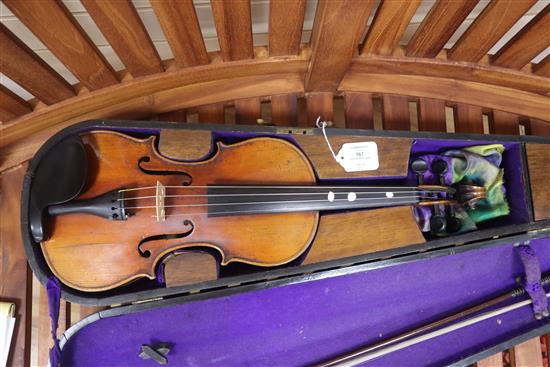 A German early 20th century violin and bow in a walnut inlaid case